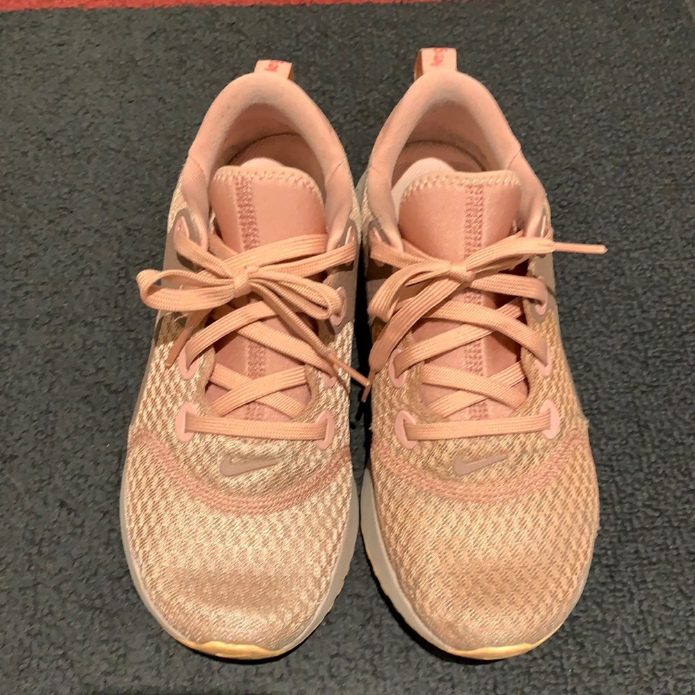 Nike women pink legend React runners size 7.5